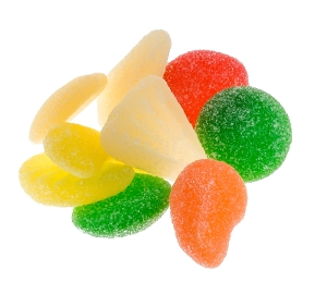 Haribo Gummi Fruit Salad is fruit flavored gummy candy in green orange white and red