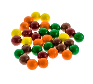 Sixlets are hard chocolate candy in yellow green purple and orange